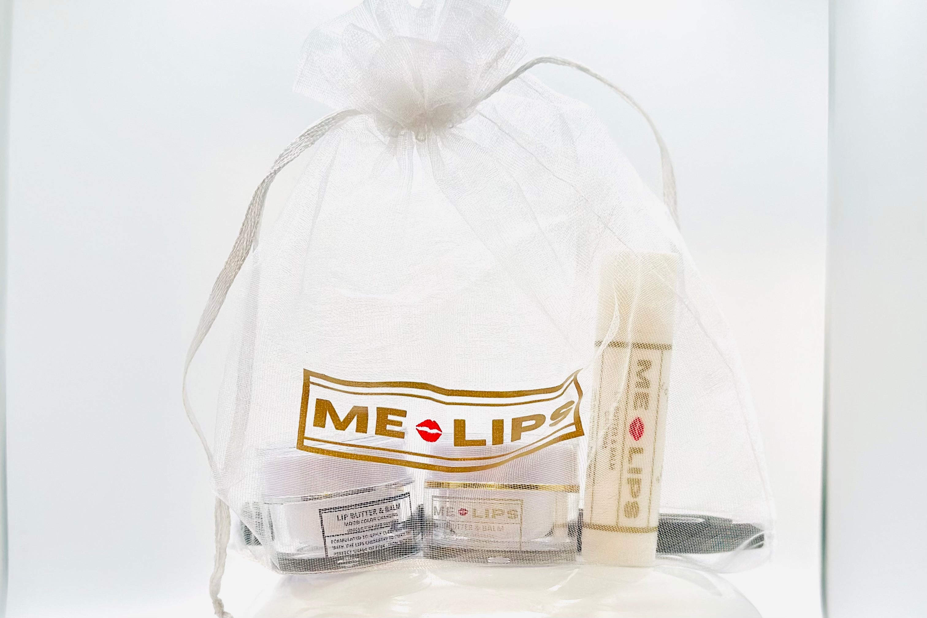Exclusive Me-Lips Pre-Order Bundle: Unveil Elegance with a Silk Bag, Original Lip Shade, 4-in-1 Unique Pink Red Shades #1 & #2, and a 2-in-1 Double-Ended Lip Brush with Cap.