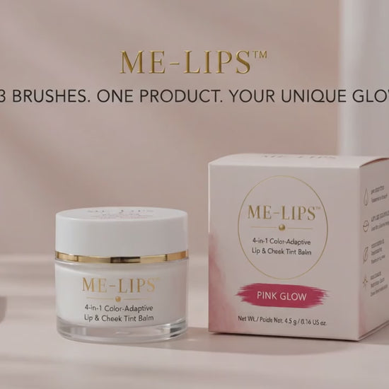 ME-LIPS 4-in-1 Color-Adaptive Lip & Cheek Tint balm in Pink Glow next to its product box and three makeup brushes, set below gold typography reading "ME-LIPS: 3 BRUSHES. ONE PRODUCT. YOUR UNIQUE GLOW."