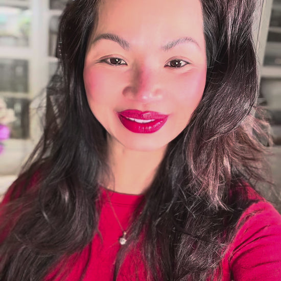 Founder Melinda applying ME-Lips™ 4-in-1 Unique Pink-Red Tint, a color-adapting lip and cheek butter, as part of her quick, natural morning makeup routine.